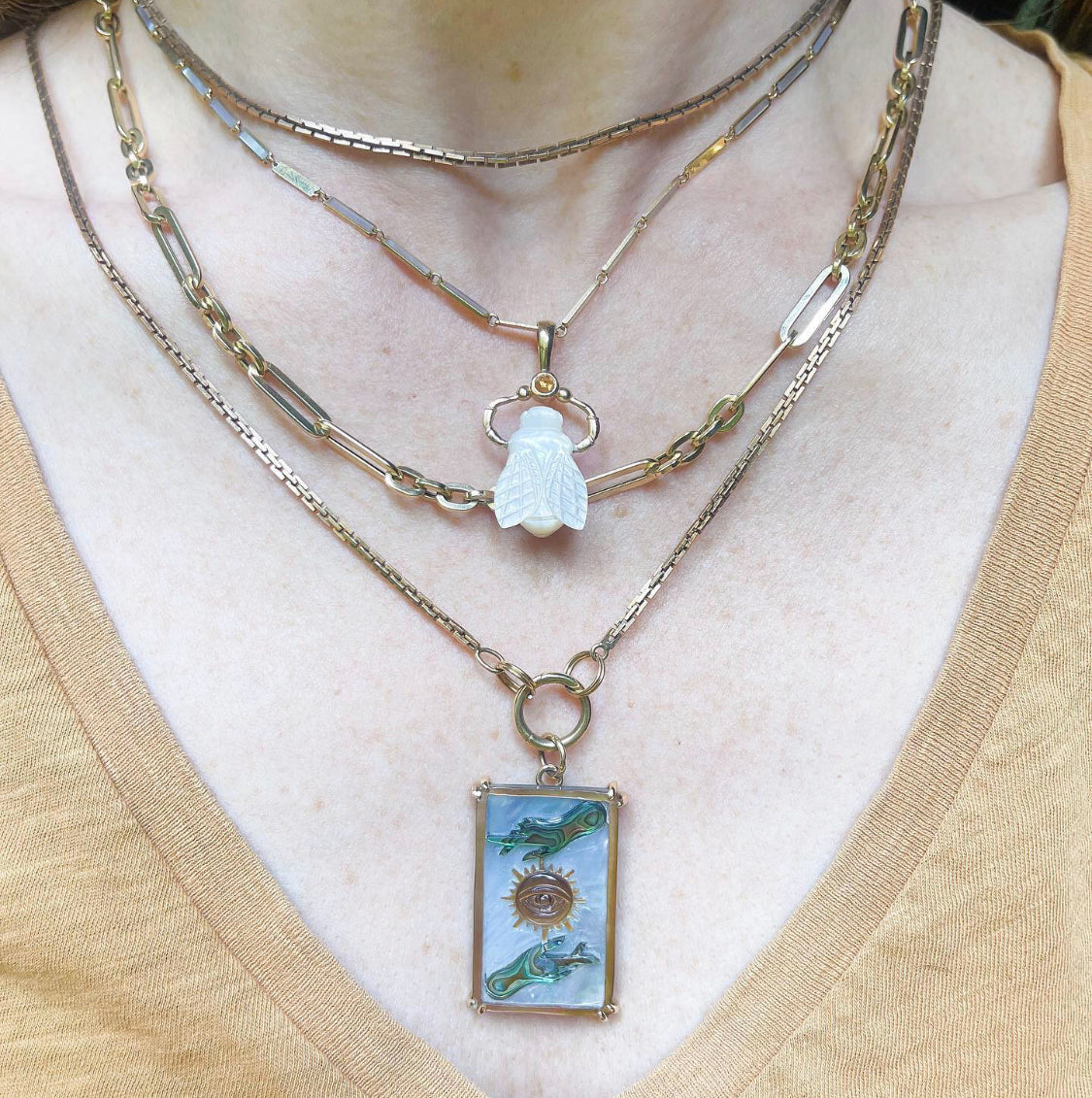 Sun Tarot Card Charm shown worn with a collection of chains and bee charm