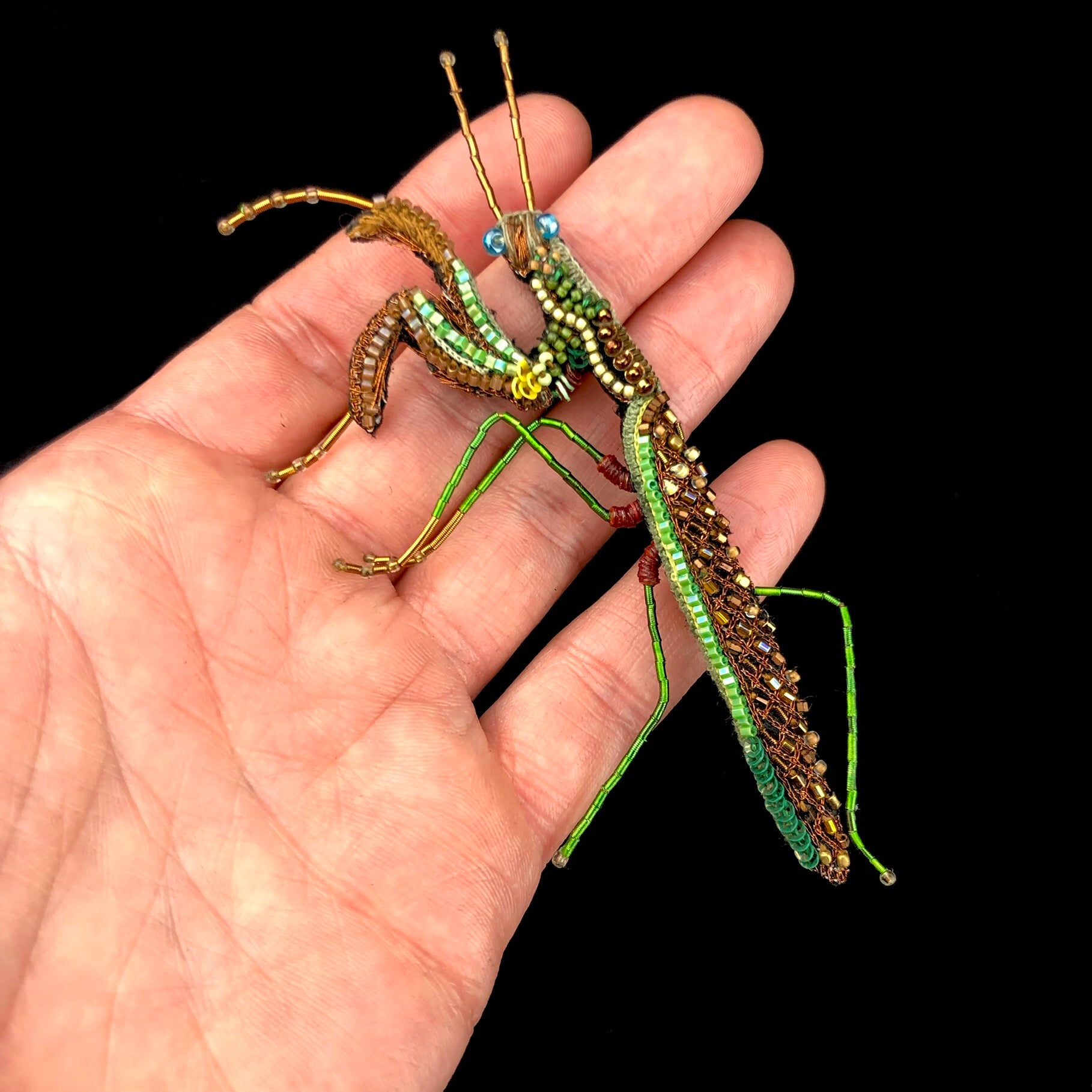 Praying Mantis Brooch Pin shown in hand for size reference