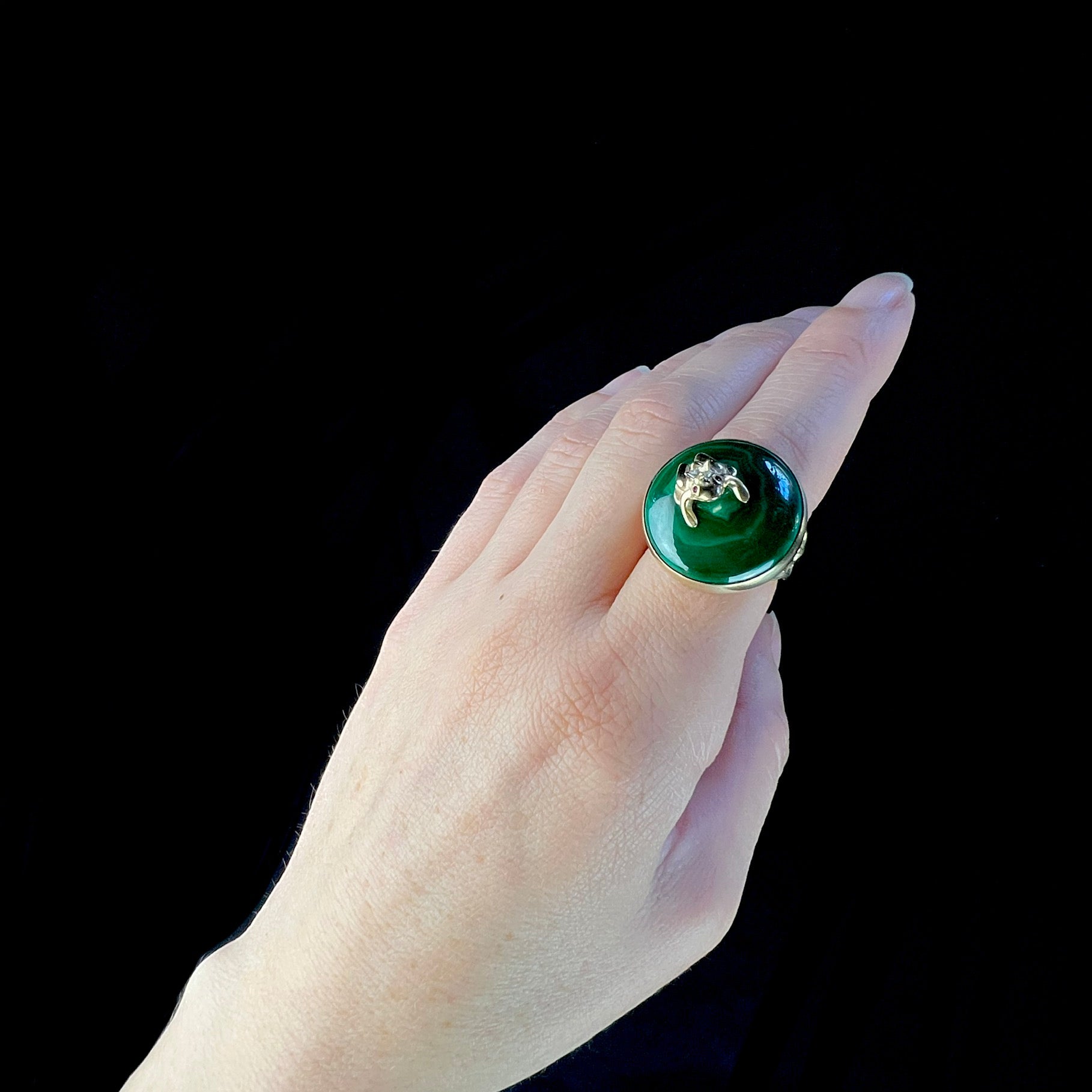 Top view of Prince Charming Malachite Ring worn on finger for size