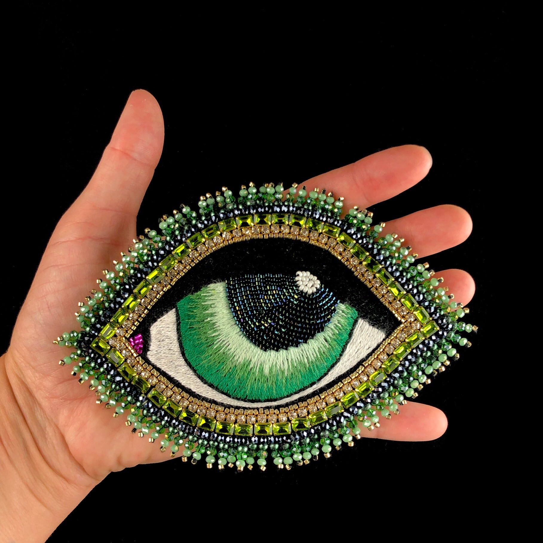 Extra Large Green Eye Brooch in hand for size referance