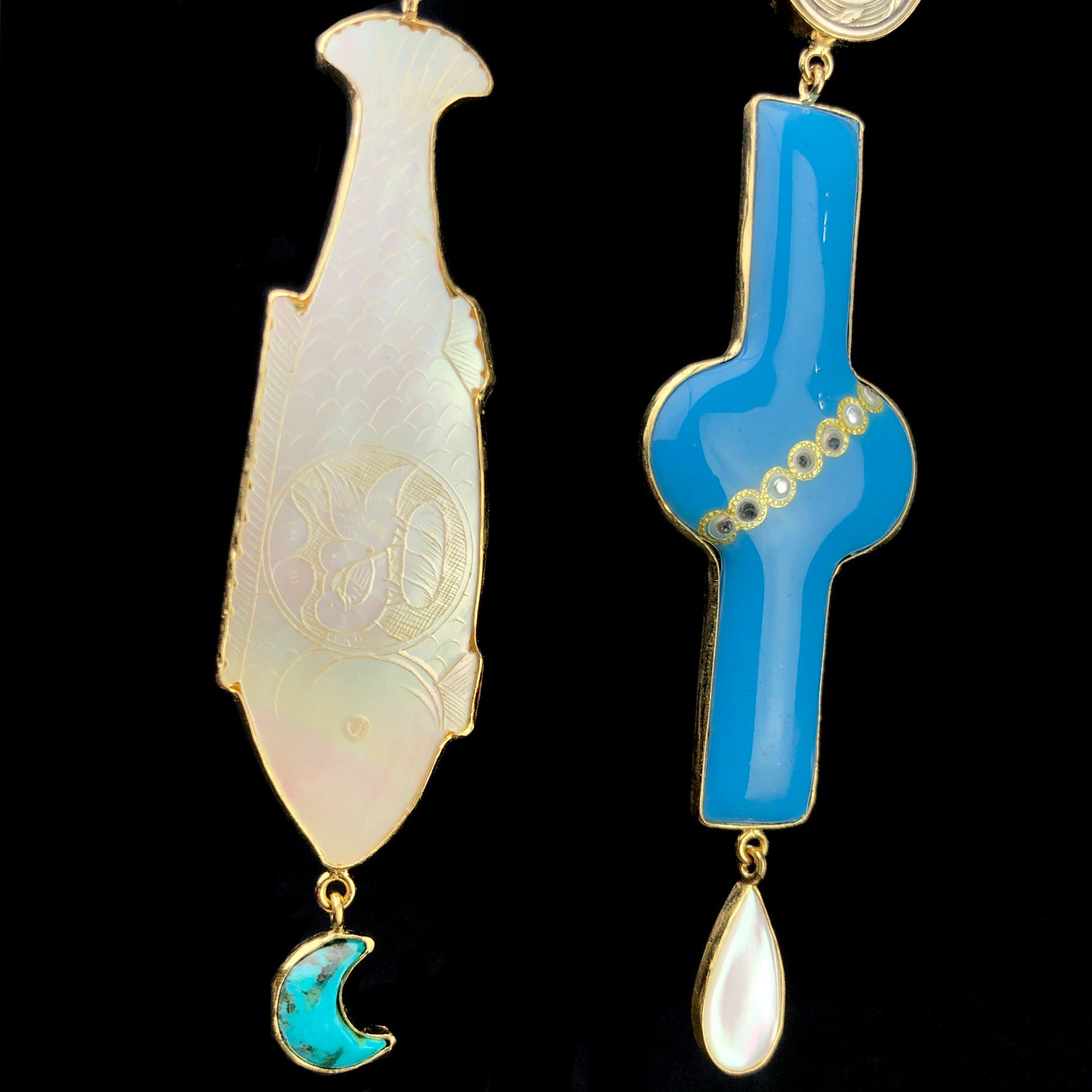 Detail view of Mother of Pearl fish token and blue enamel buckle used to make the Blue Fish Earrings