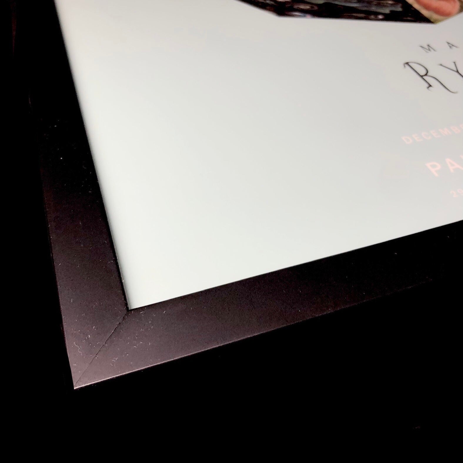 Detail of black frame used to display the Dodecahedron Show Poster