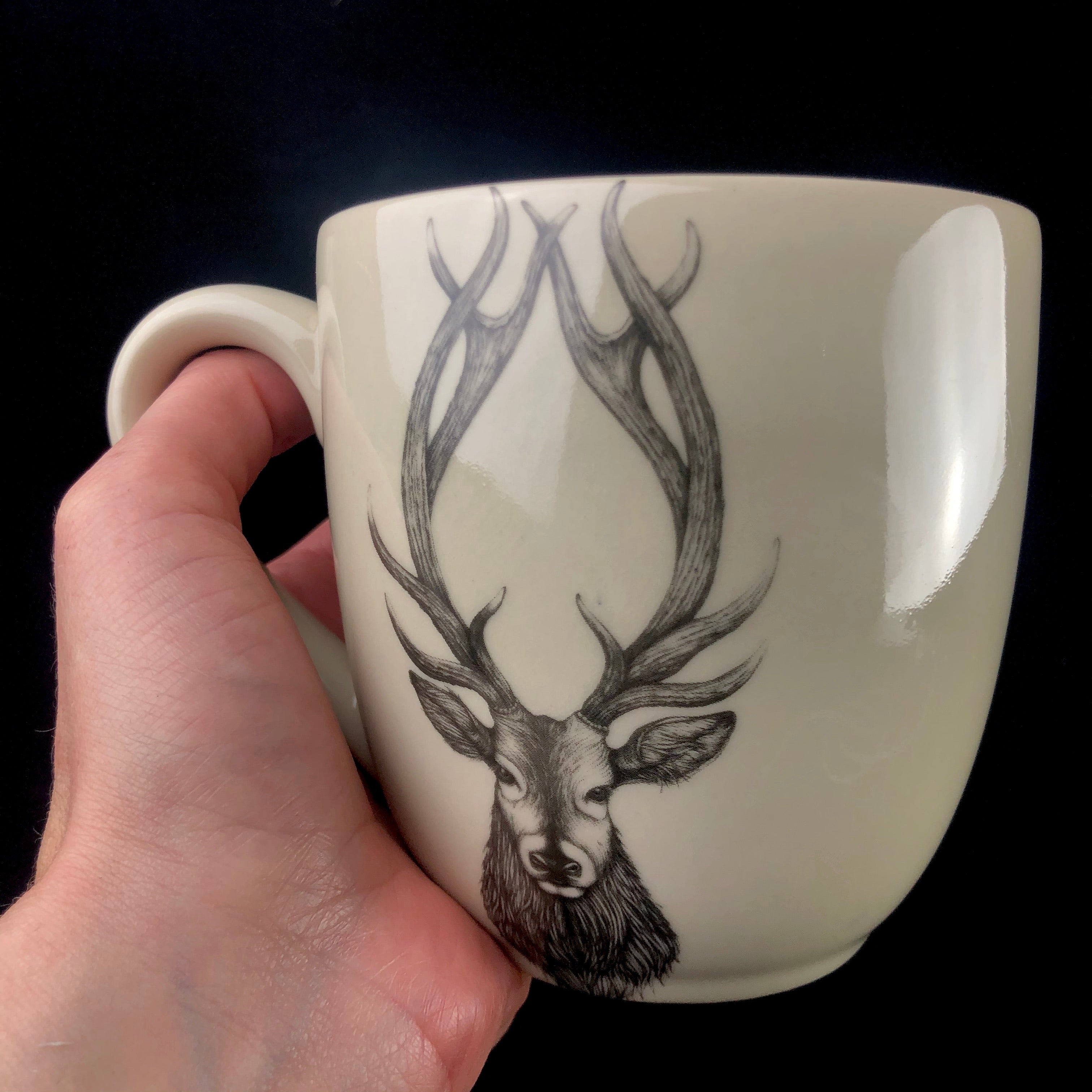 Buck Mug shown in hand for size reference