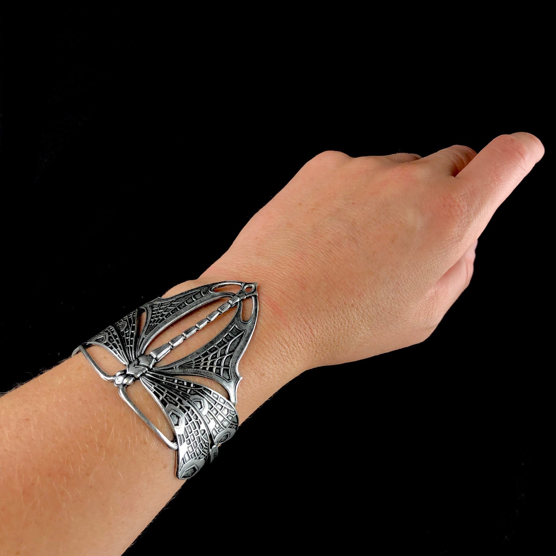 Silver Dragonfly Cuff shown on wrist